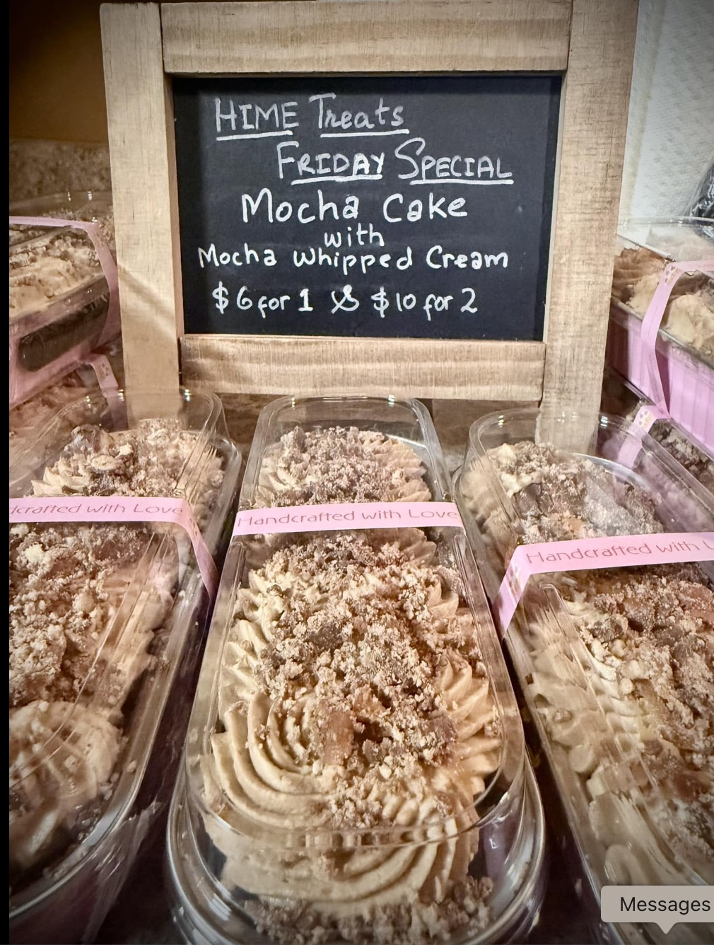 HIME Treats Friday Special mocha cakes displayed with a handwritten chalkboard sign